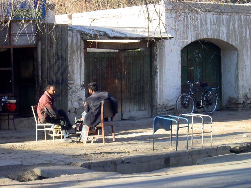 Two Men in front of Shop